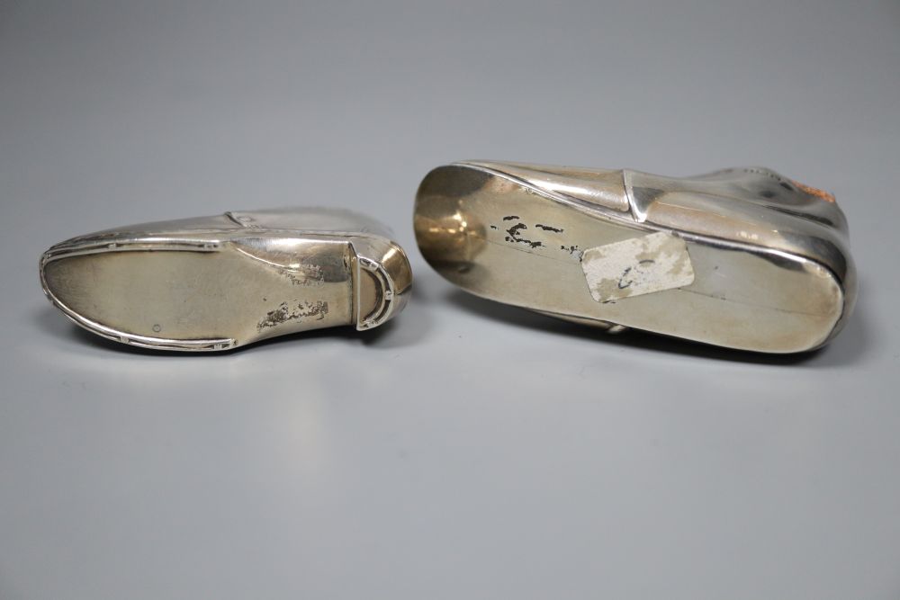 Two early 20th century novelty silver mounted pin cushions, modelled as shoes,